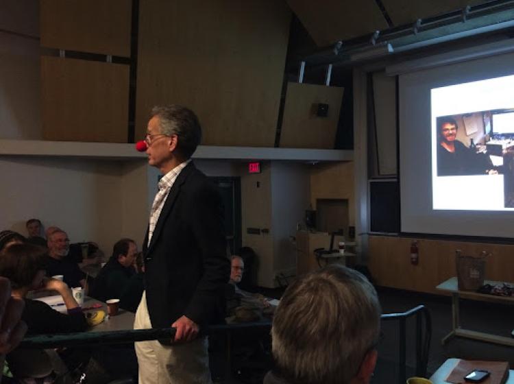 Dr. David Peyton wears a clown nose and presents at a seminar.