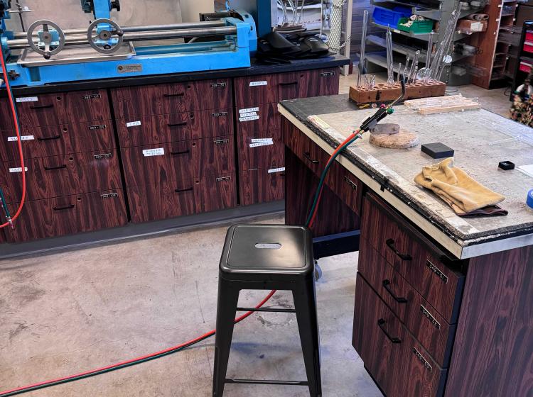 Photo of glassblowing classroom showing many pieces of specified machinery.