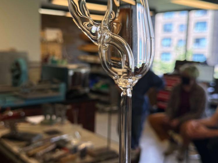 student showing off piece they've made