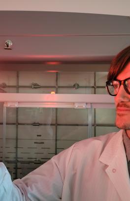 Robert Fitzmorris holding glowing test tube