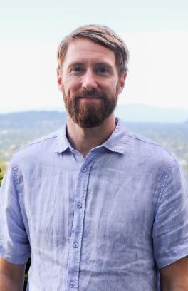 James Frank, a white man with short red hair and beard. 