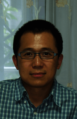 Gang Lin, an asian man with short black hair and glasses looking at the camera. 
