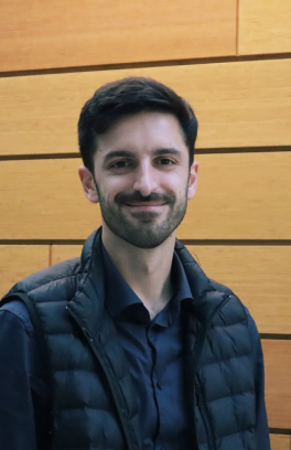 Paul Kempler, a young white man with short brown hair and a puffy vest on. 