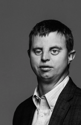 A black and white photo of Hoby Wedler, a light skinned person with short dark hair.