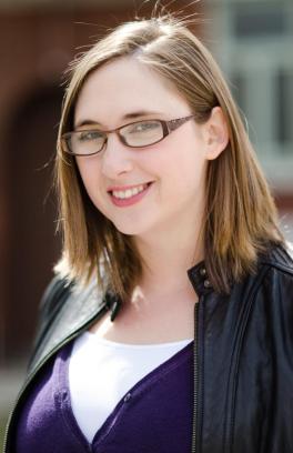 Professional photo of Theresa McCormick, a white woman with midlength brown hair and glasses.