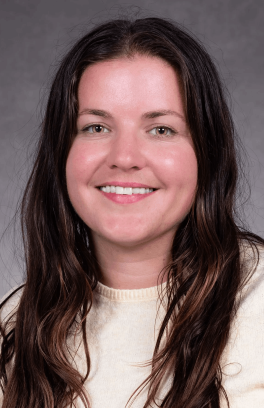 A professional headshot of Morgan Balabanoff, a white woman with long dark hair and light brown eyes. 