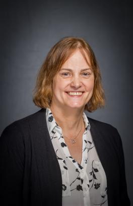A photo of Robyn Tanguay, a white woman with red hair cut into a bob.