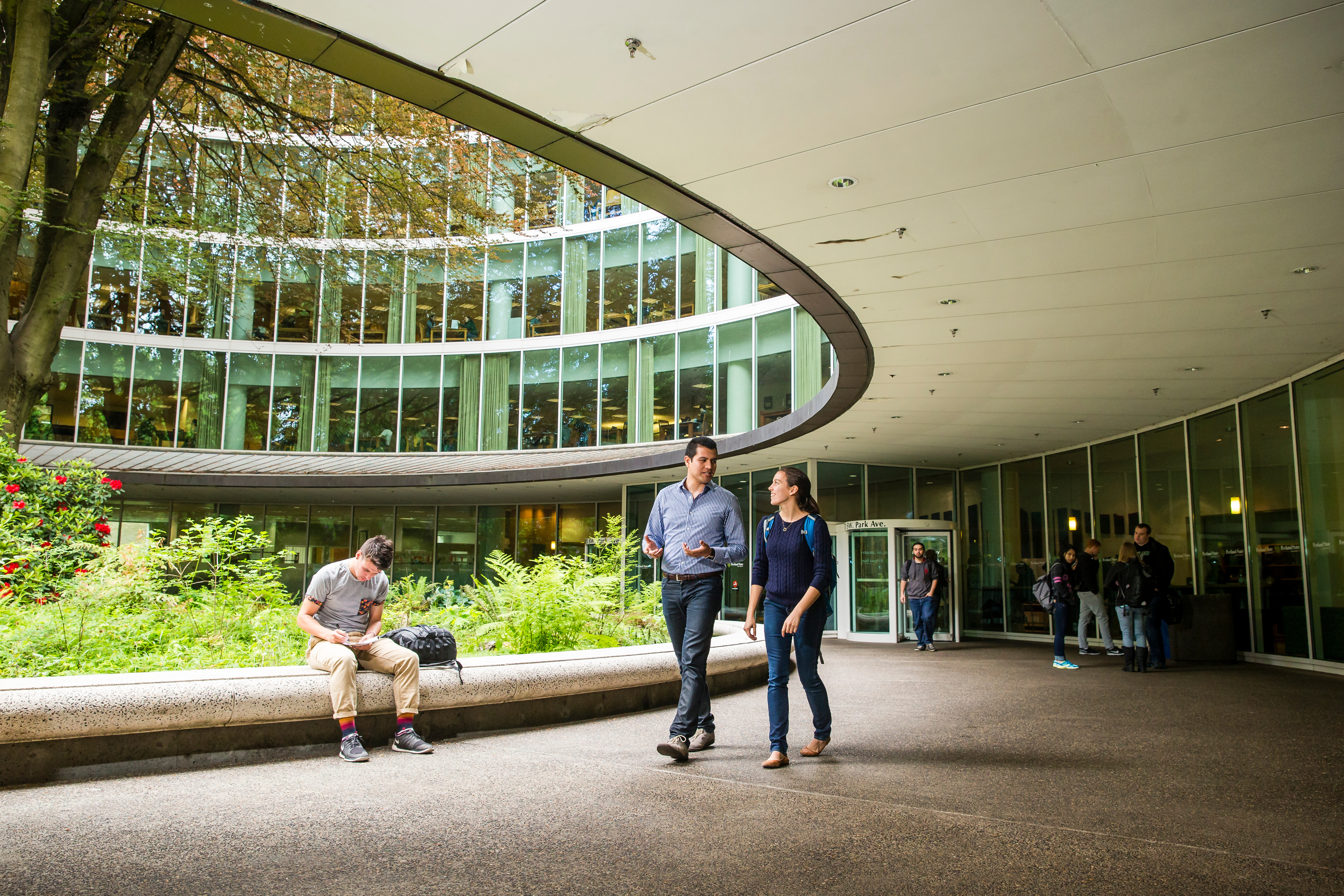 Students walking in front of the PSU library