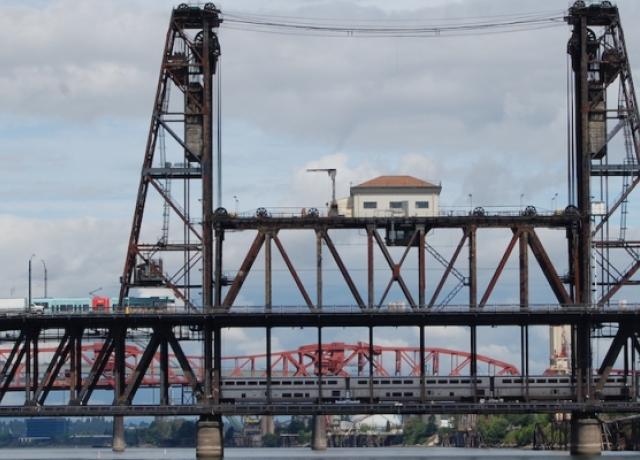 View of the Steel Bridge, a through truss, double-deck vertical-lift bridge across the Willamette River in Portland, Oregon.