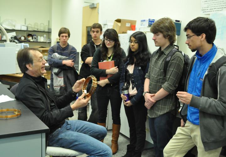 a professor lecturing to a group of students