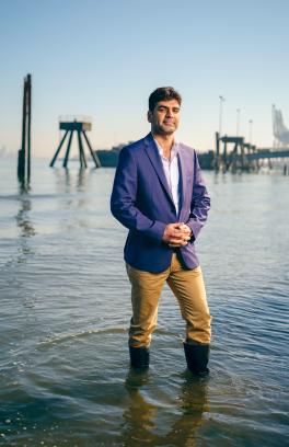 Engineering student standing in river