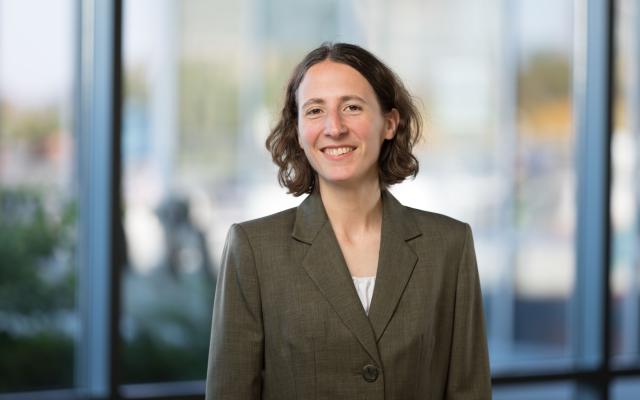 Headshot of Mary Ann. Mary Ann is wearing a suit jacket and smiling.