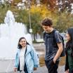 Three students walking and having a conversation