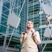 graduate student standing in front of a building