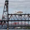 View of the Steel Bridge, a through truss, double-deck vertical-lift bridge across the Willamette River in Portland, Oregon.