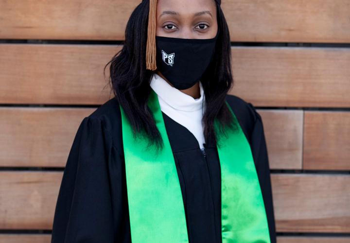 PSU student wearing PSU regalia and mask from the University Market
