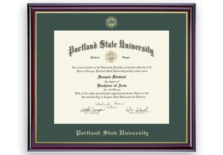 Portland State University diploma in a green and gold PSU-branded frame with university seal and dark wood border