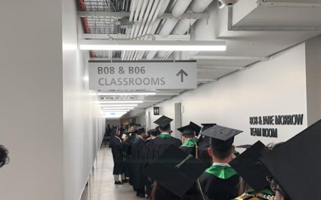 Graduates line up in processional