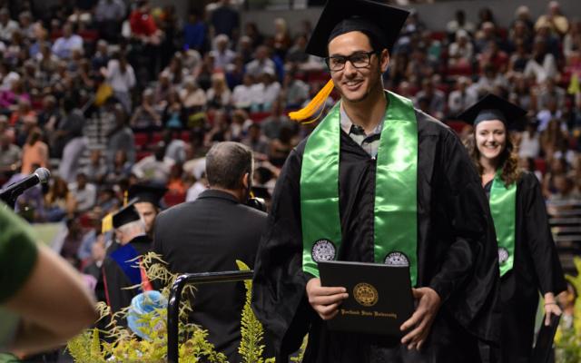 Student getting his diploma at commencement