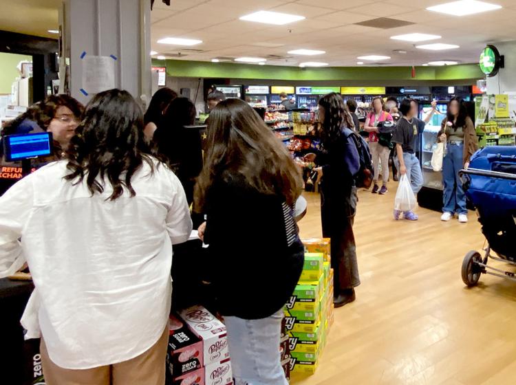 Students shop at the University Market in Smith