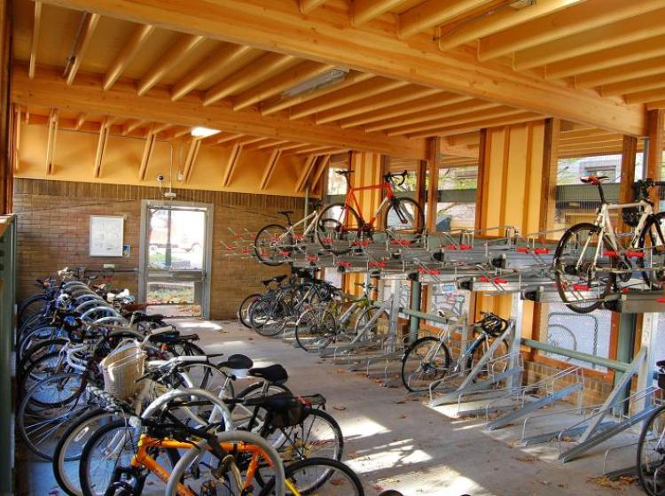 Photograph of the completed cycle station on Montgomery St containing dozens of bike racks for secure campus bike storage