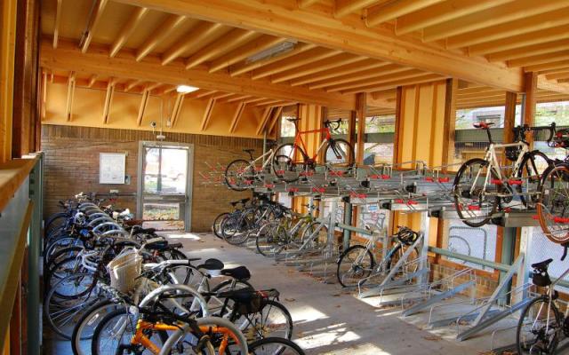 Photograph of the completed cycle station on Montgomery St containing dozens of bike racks for secure campus bike storage