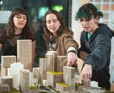 students working on a model of a city