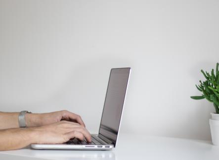 Hands on a laptop computer