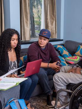 group of four students, one of whom is a wheelchair user