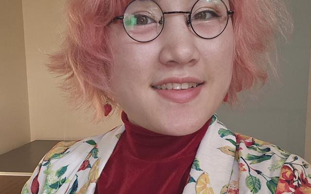 Headshot photo of Em Nakamura