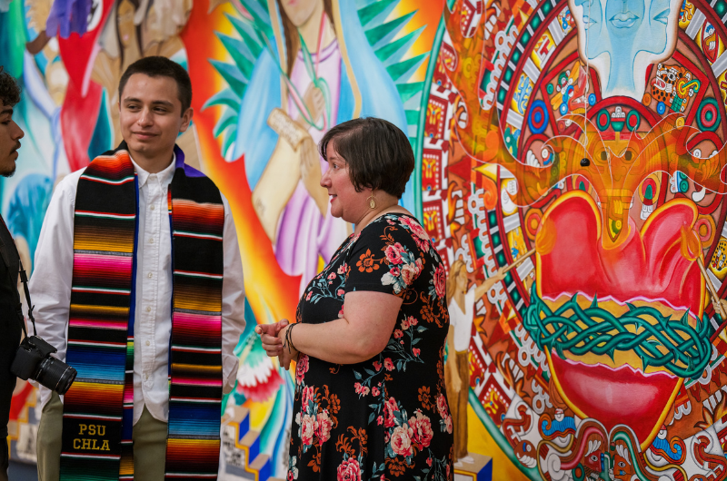 Students and professor at graduation celebration for Chicanx/Latinx Studies