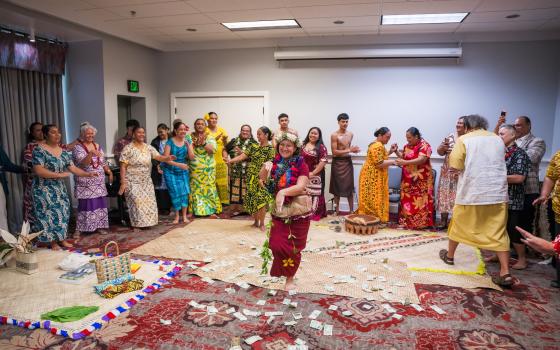 Pacific Islander professor dancing in circle