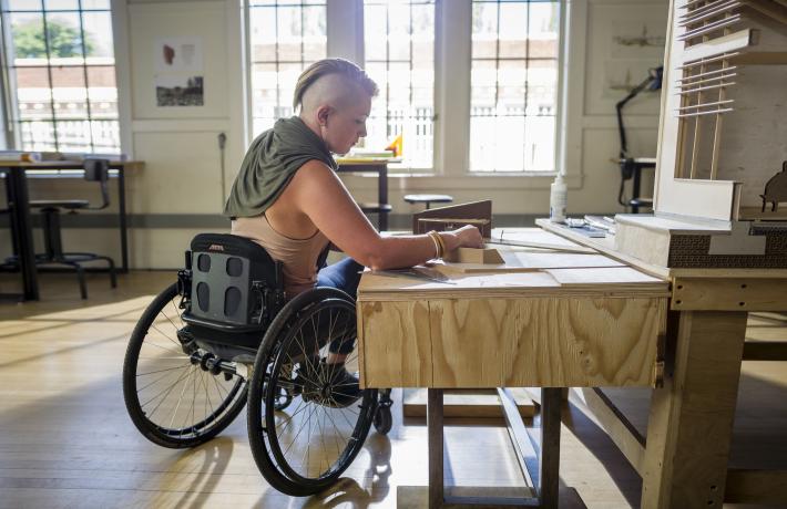 Wheelchair user in architecture studio