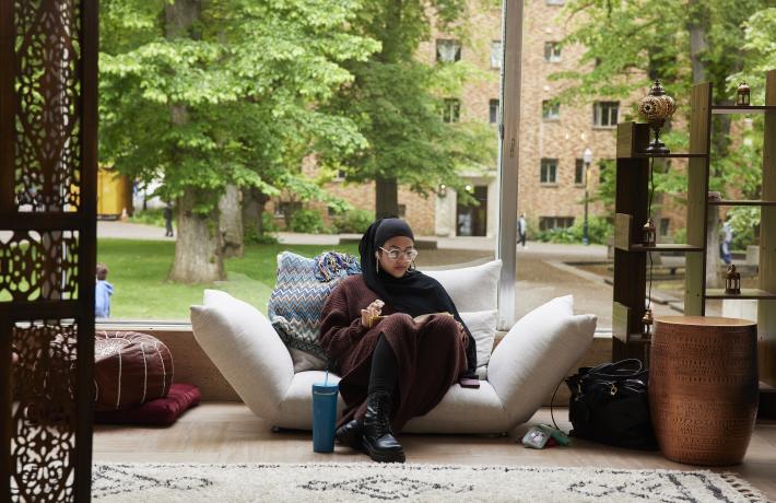 Student on couch in MENASA