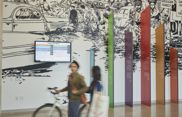 Students walking past mural in Vanport Building