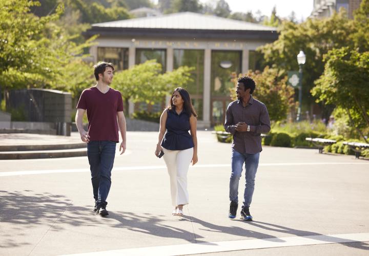 Students in Walk of the Heroines with Hoffmann Hall in the background