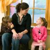 Photo of a woman and two children