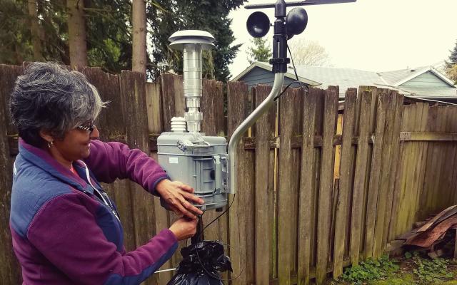 Researcher measuring air quality
