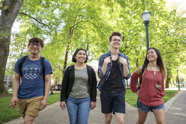 Four students walking in the Park Blocks
