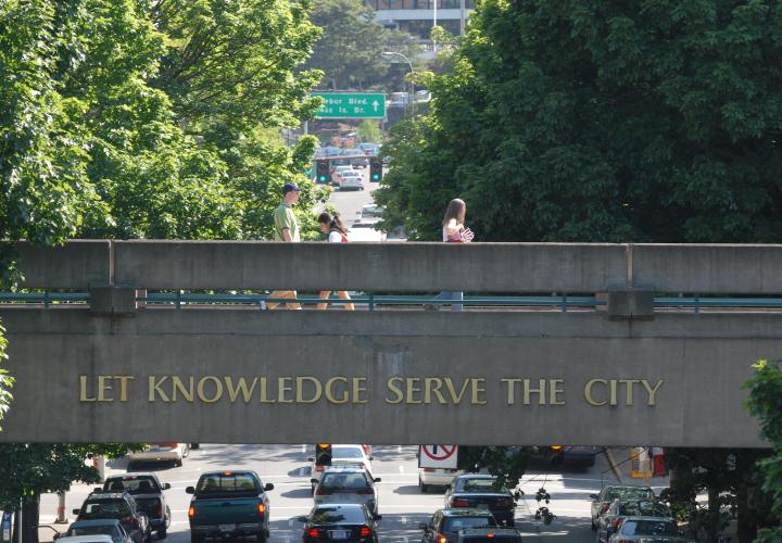 PSU skybridge that says "Let Knowledge Serve the City"