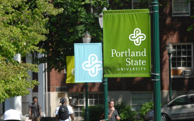 Two PSU flags with partial PSU flag behind the middle flag