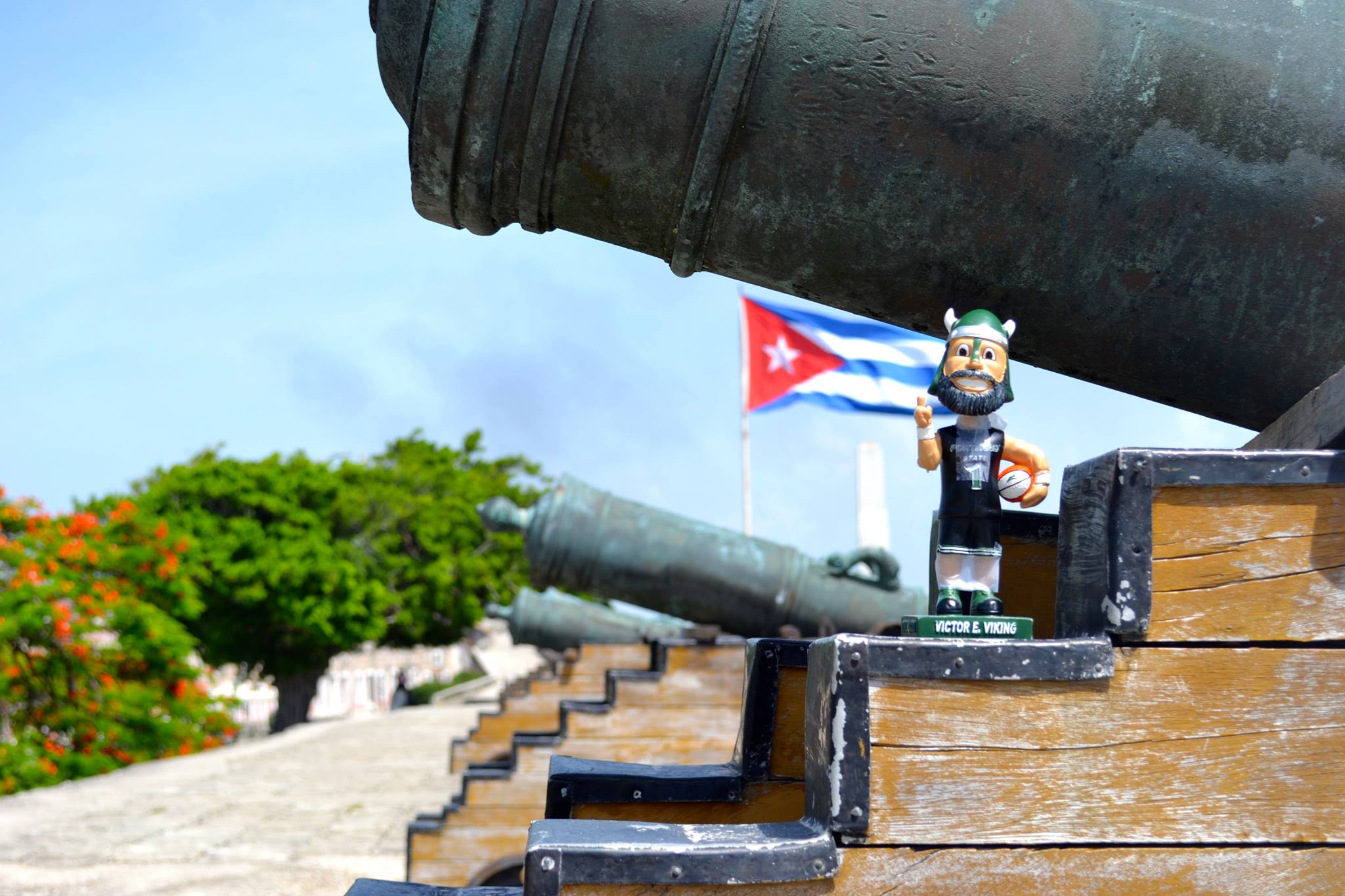 Victor Viking statue in front of Cuban flag