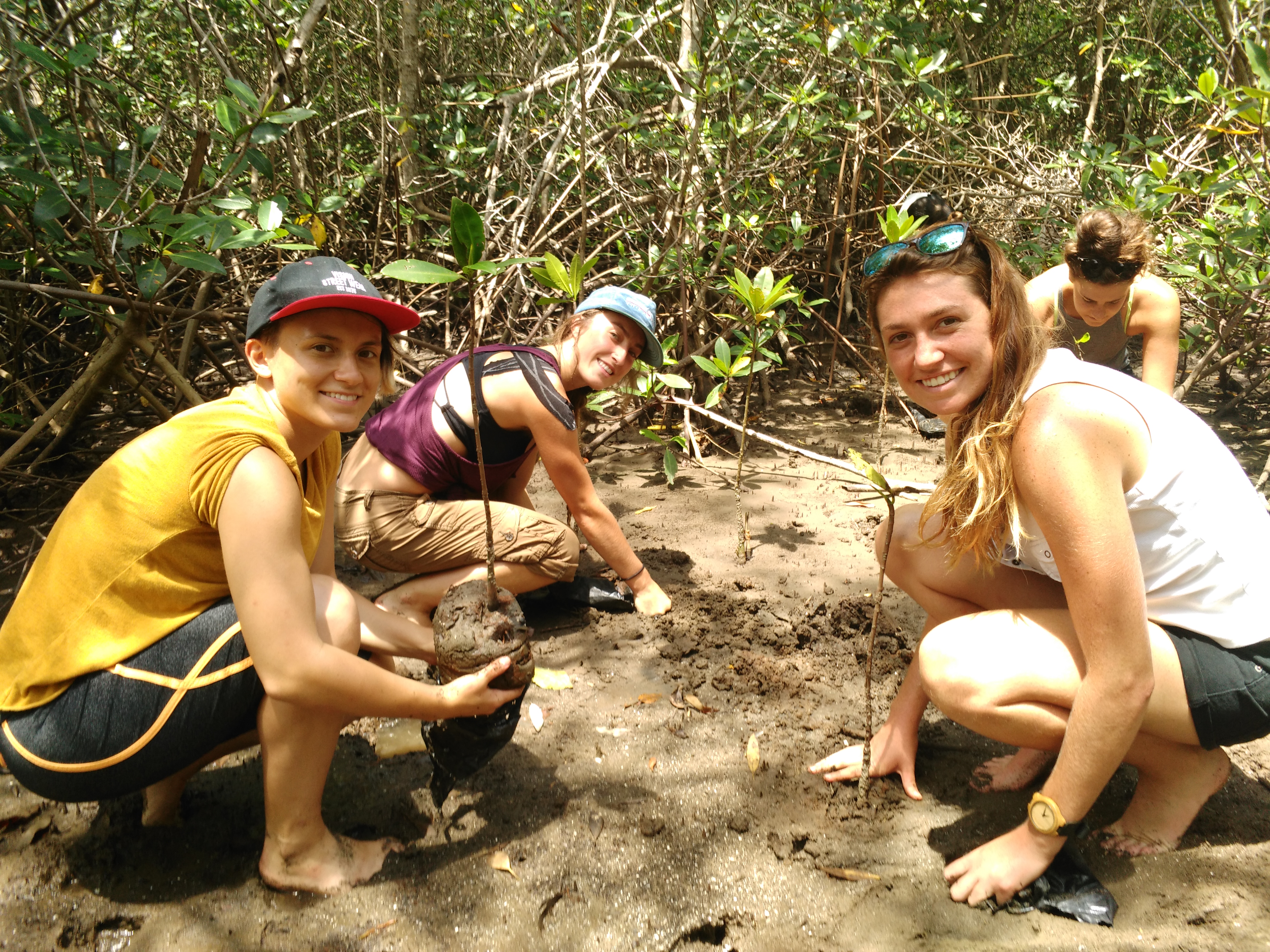 Students in Costa Rica working in mud
