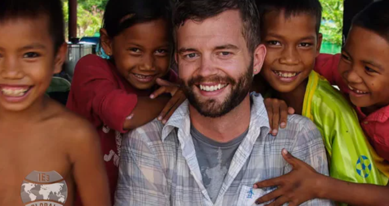 Man with kids, smiling