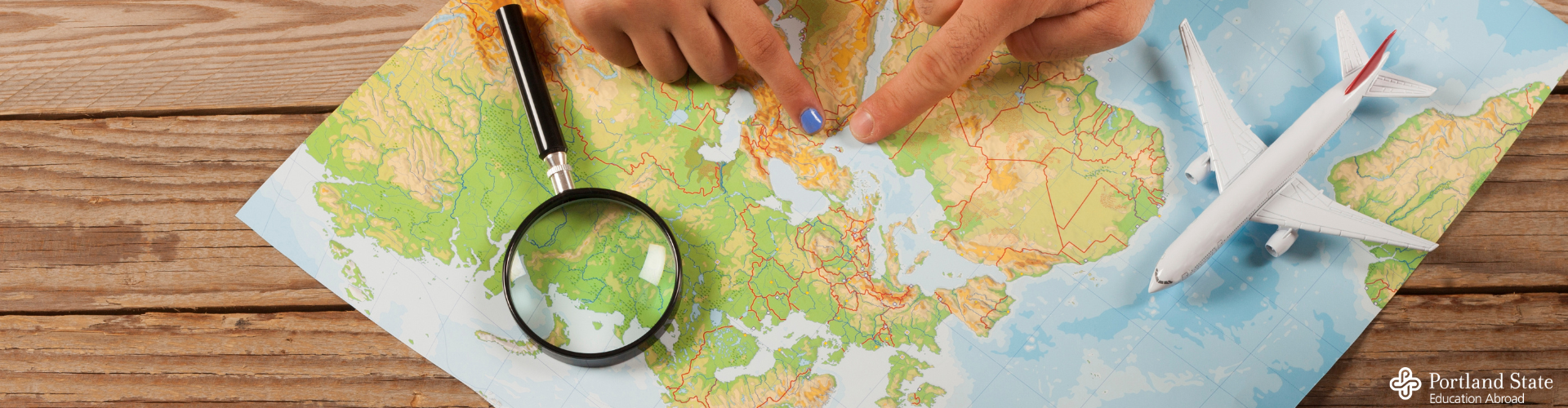 fingers pointing on map