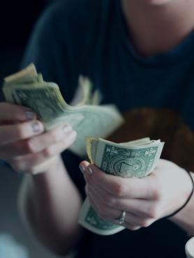 person counting money