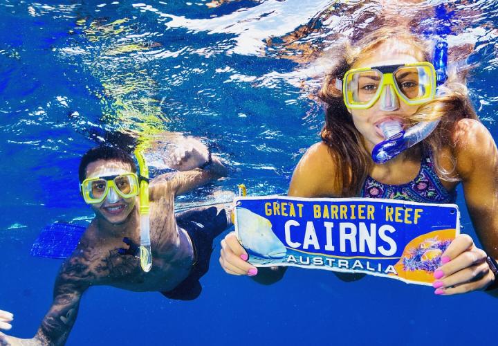 students snorkeling in great barrier reef