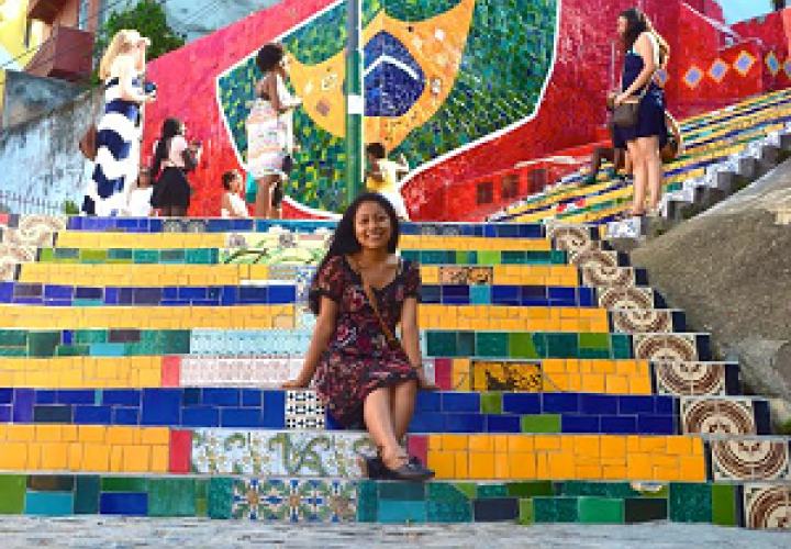 woman sitting on brightly colored steps