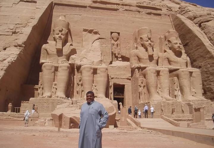 Fulbright scholar standing in front of Egyptian monument