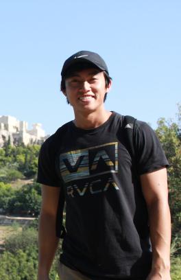 PSU Student standing in front of the Acropolis in Greece